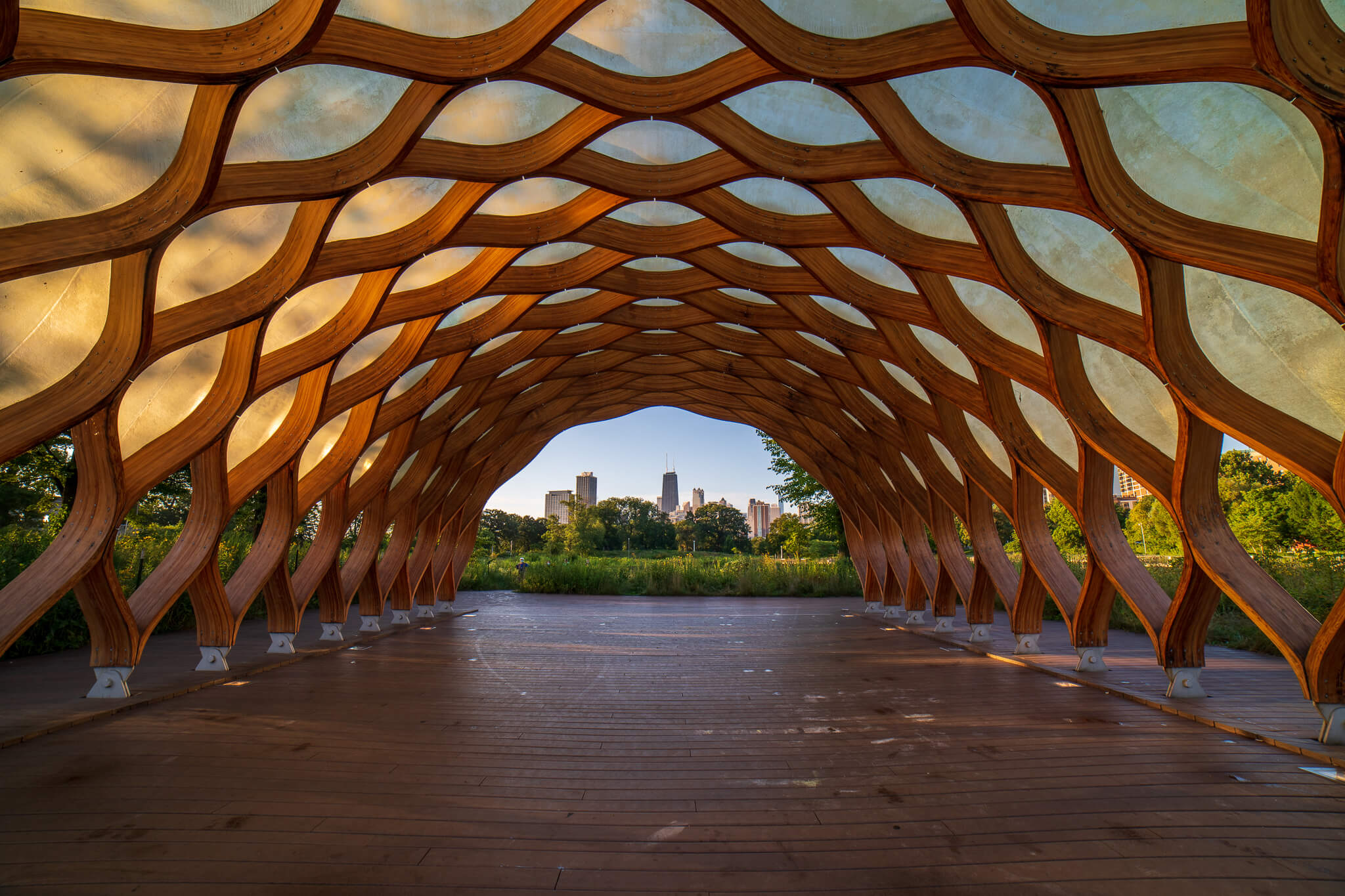 Lincoln Park Pavilion wooden arch tunnel framing Chicago skyline