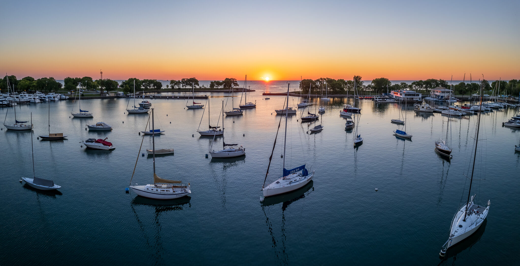 Lincoln Park Pavilion exterior at golden hour with crow