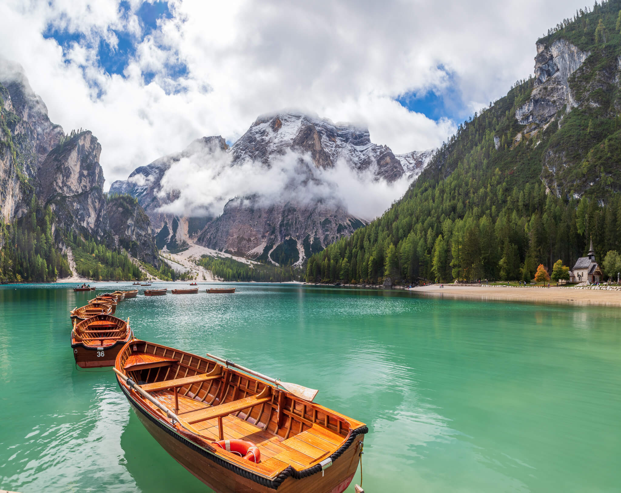 Wooden rowboats moored at Lago di Braies