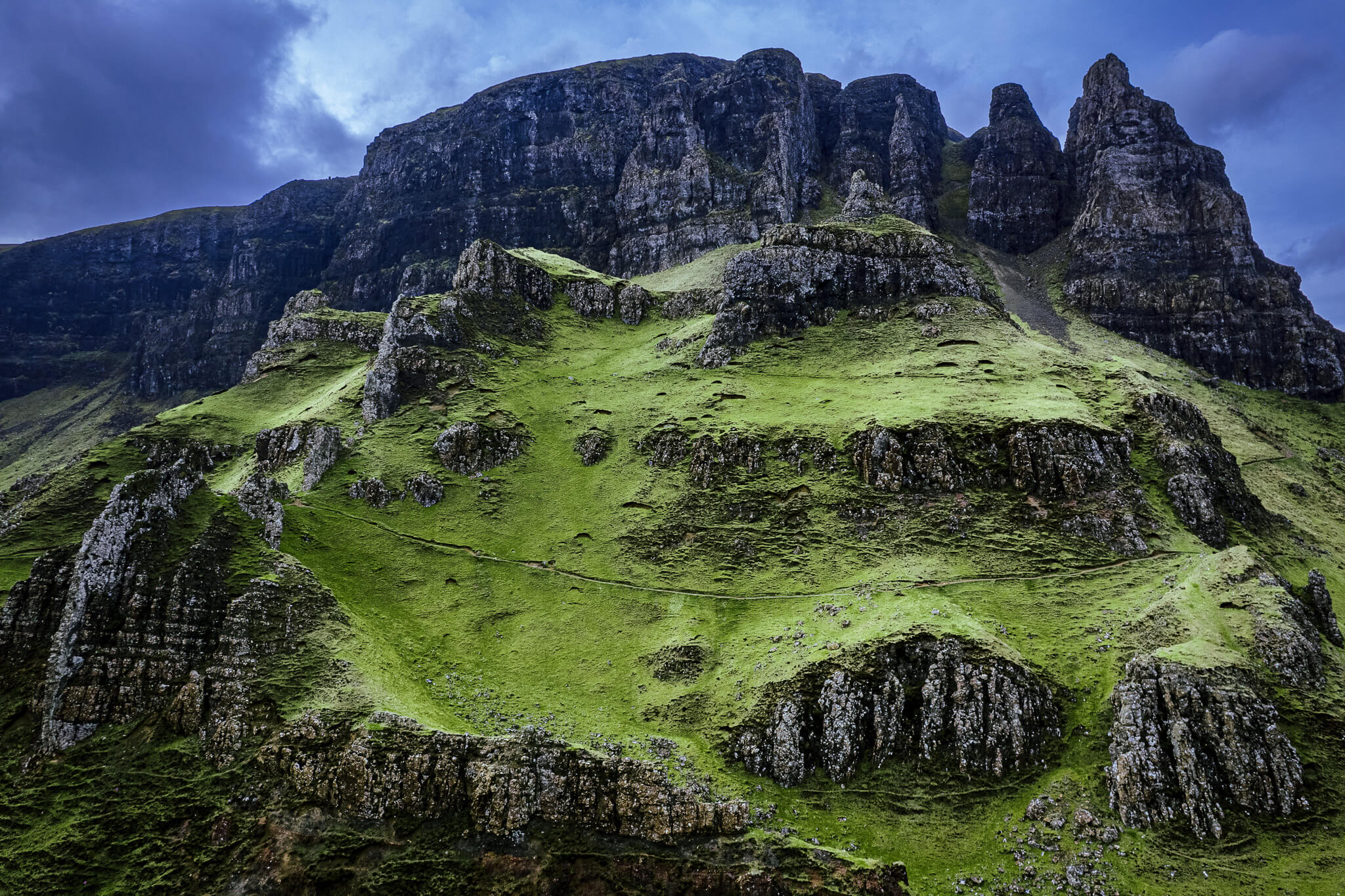 Dramatic green cliffs and rocky pinnacles of the Quiraing, Isle of Skye